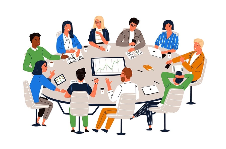 Staff discussion at oval table