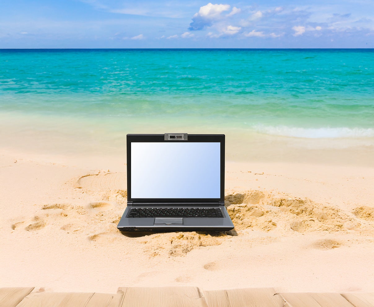laptop on a beach