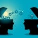 abstract image of two people's heads transferring knowledge