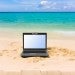 laptop on a beach